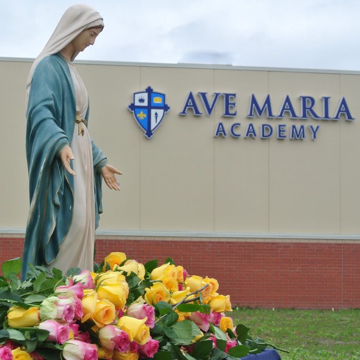 Statue of the Blessed Virgin Mary in front of the Ave Maria Academy building