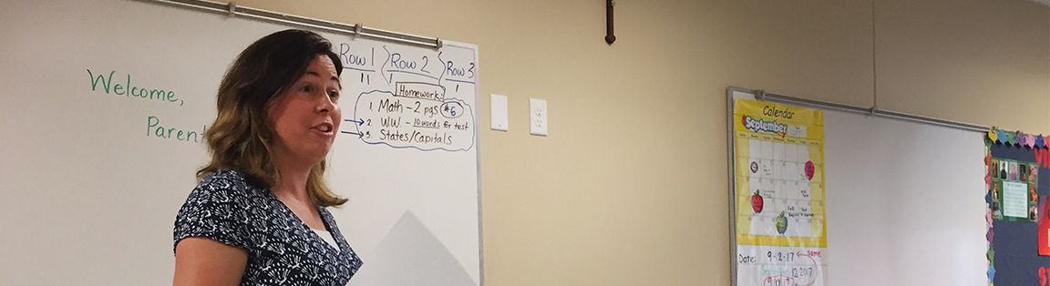 An instructor at a whiteboard